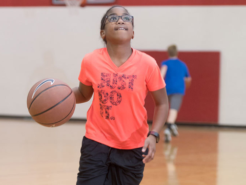 basketball camper driving to the hoop at camp