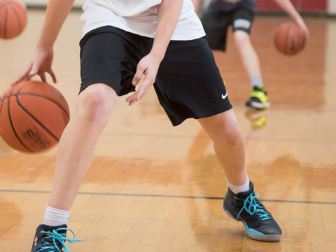 Campers at McCracken Basketball Camp working on handles