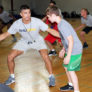 McCracken basketball camp coaches working on defensive drills